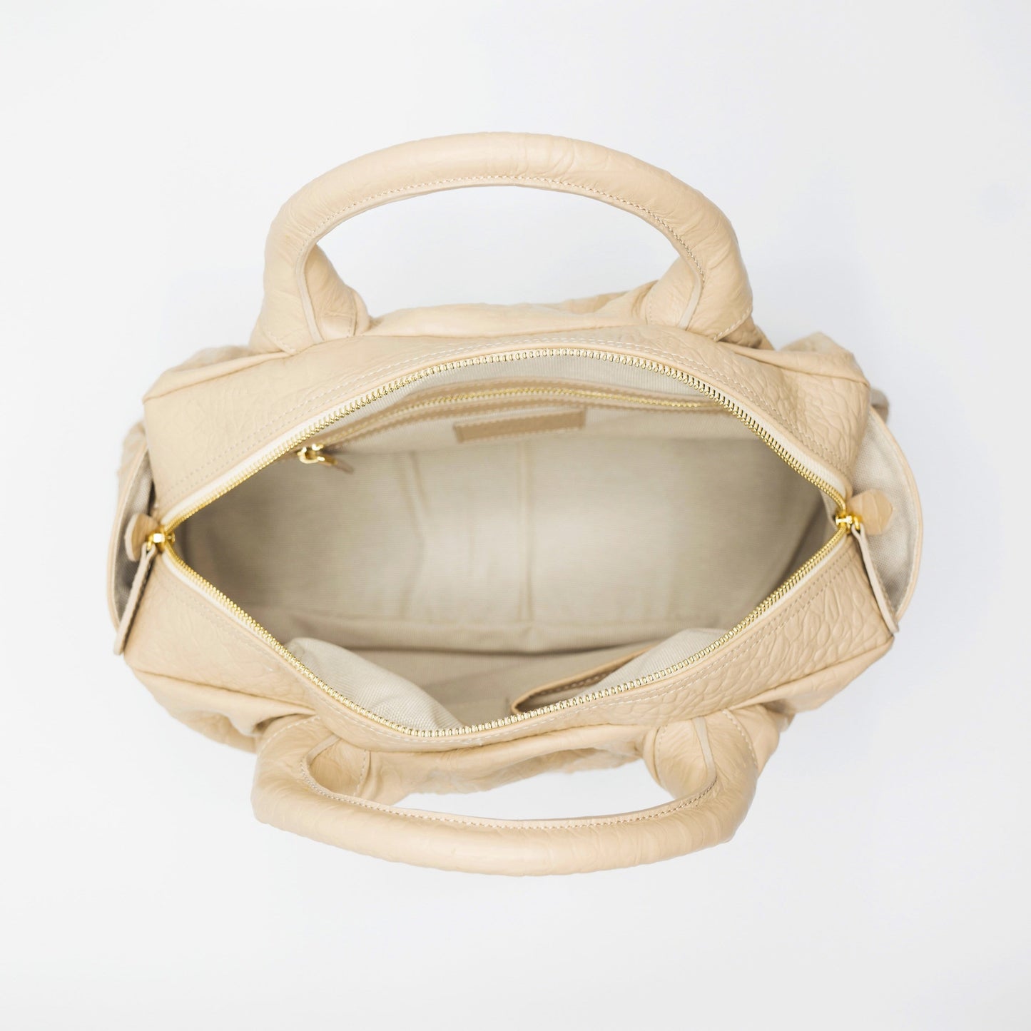 Blush sustainably sourced, crocodile embossed Turkish leather. This medium-sized handbag, tote, and messenger is expertly crafted to our exacting standards. 